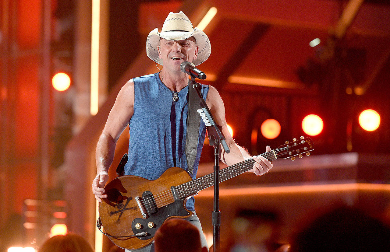 Kenny Chesney’s summer tour is scheduled to come to CenturyLink Field in Seattle on July 17, 2021. (Associated Press)