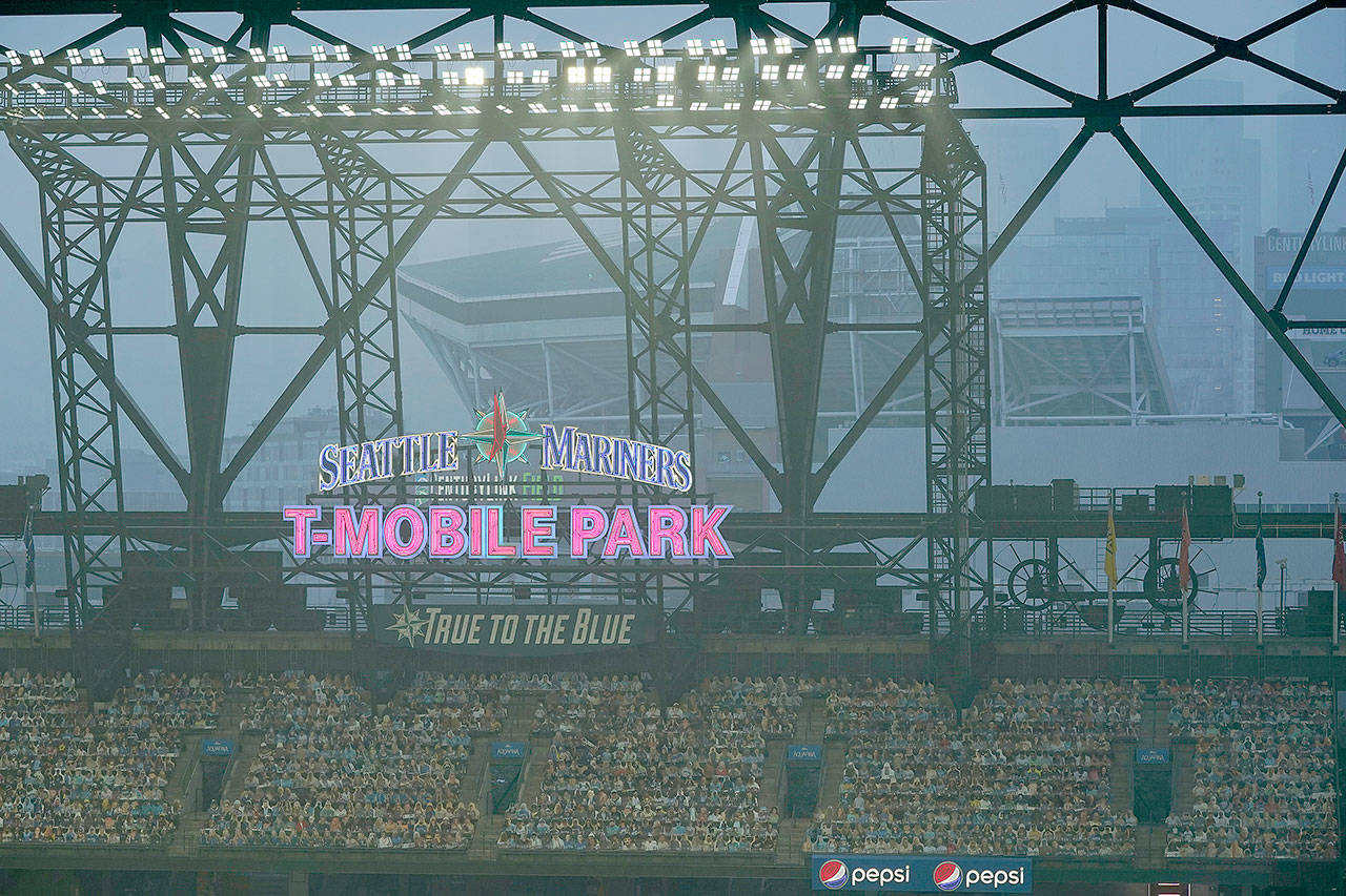 Smoke from wildfires fills the air at T-Mobile Park on Monday, where the Mariners split a doubleheader with the Oakland Athletics. (Ted S. Warren / Associated Press)