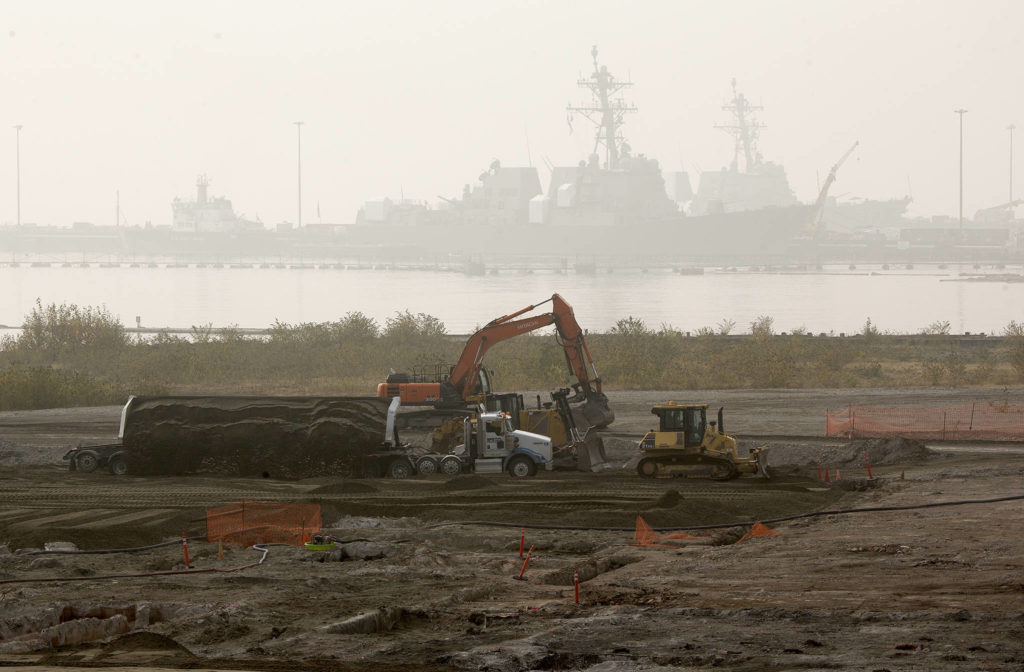 At the site of a former Kimberly-Clark paper and pulp mill, a side loader dumps dirt as crews work on Tuesday in Everett. The Port of Everett has won nearly $18 million in federal funding to help pay for the construction of a cargo terminal on the land. (Andy Bronson / The Herald)
