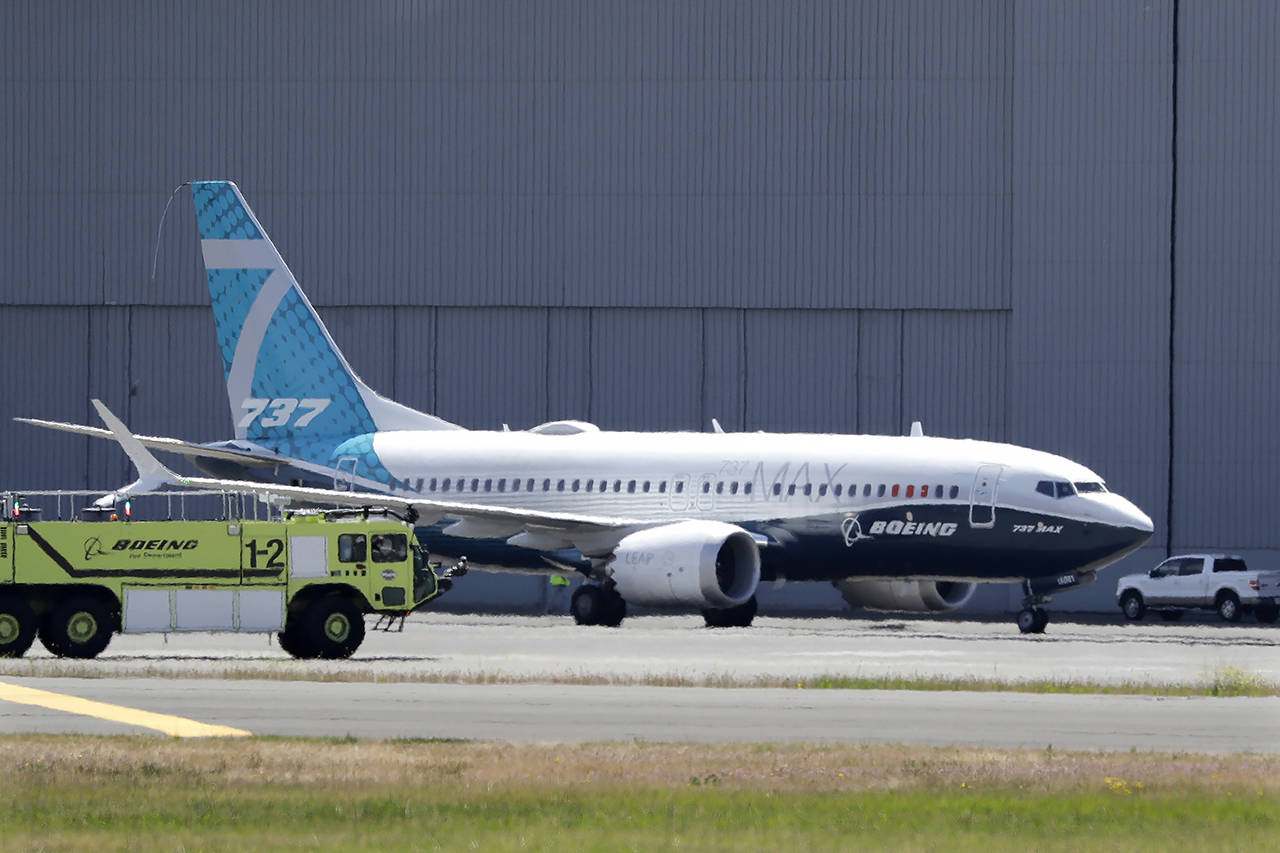 A Boeing 737 Max jet taxis after landing at Boeing Field following a test flight June 29 in Seattle. (AP Photo/Elaine Thompson, file)