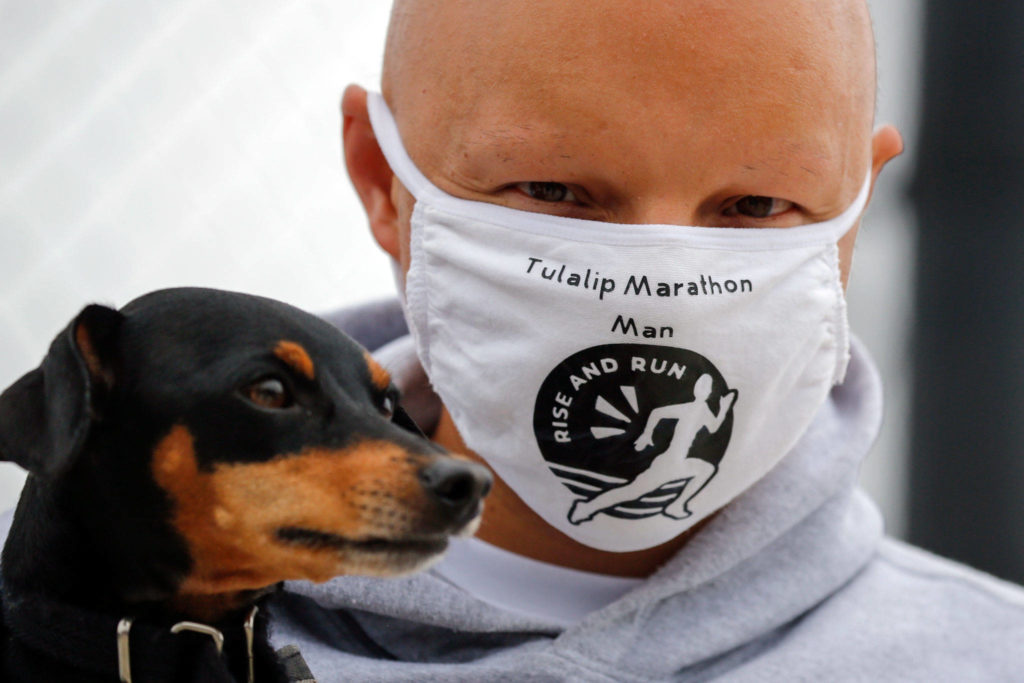 Tyler Fryberg ran the last mile in a 1,000-mile challenge to raise money for Leah’s Dream Foundation on Saturday afternoon in Tulalip. (Kevin Clark / The Herald)
