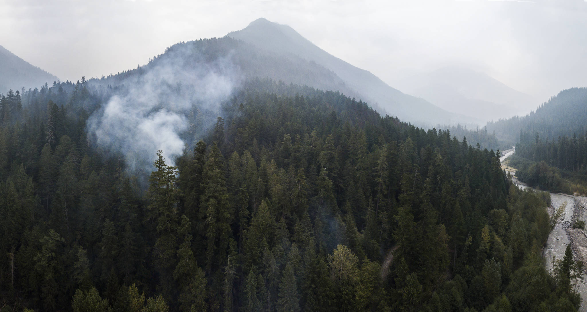 Smoke rises from the Downey Creek fire Sept. 18 off of Suiattle River Road in Darrington. (Olivia Vanni / The Herald)