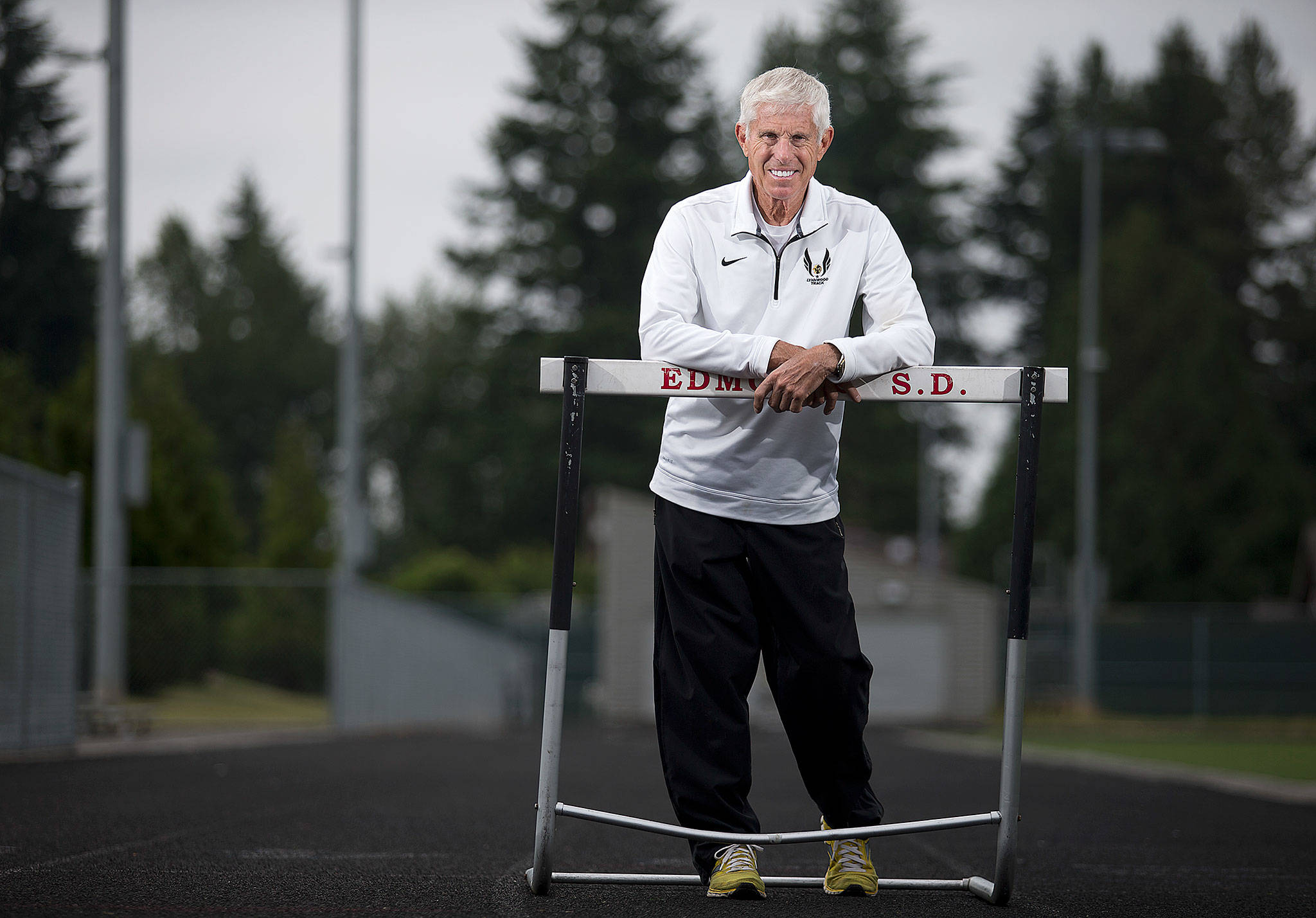 In his 46 years in Lynnwood’s track and field program, Duane Lewis coached 30 individual state champions and had 12 teams earn top-five finishes at state. (Andy Bronson / The Herald)