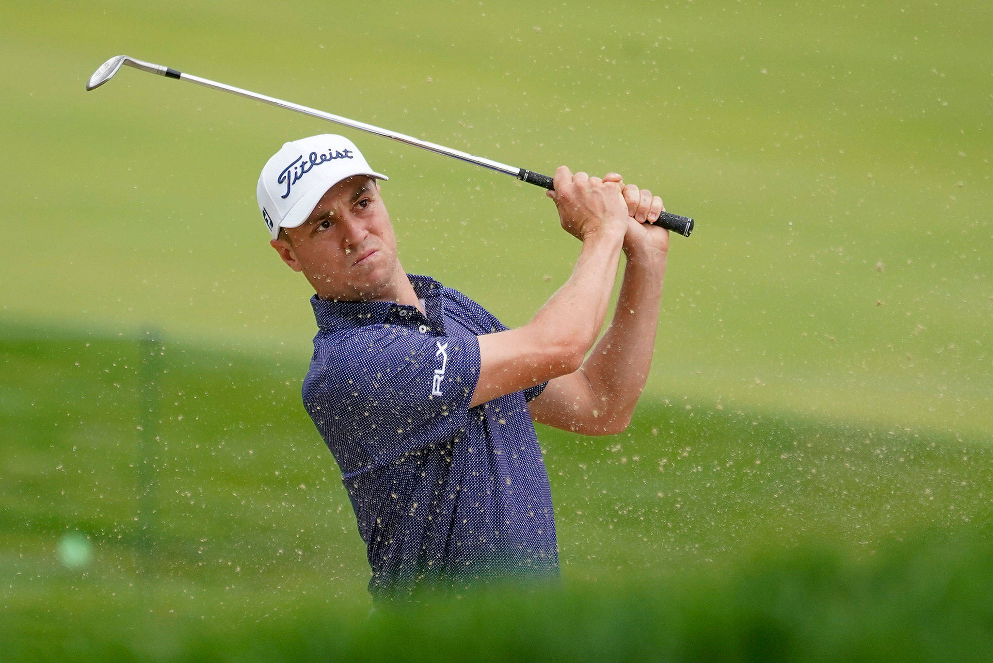 Justin Thomas plays a shot from a bunker on the 17th hole during the first round of the U.S. Open on Sept. 17, 2020, in Mamaroneck, N.Y. (AP Photo/Charles Krupa)