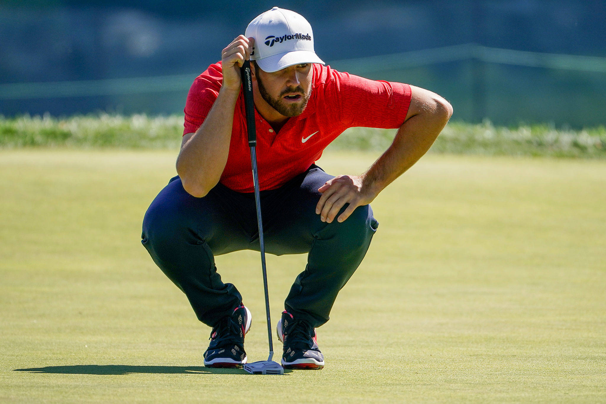Matthew Wolff lines up a putt on the second green during the third round of the U.S. Open on Sept. 19, 2020, in Mamaroneck, N.Y. (AP Photo/John Minchillo)