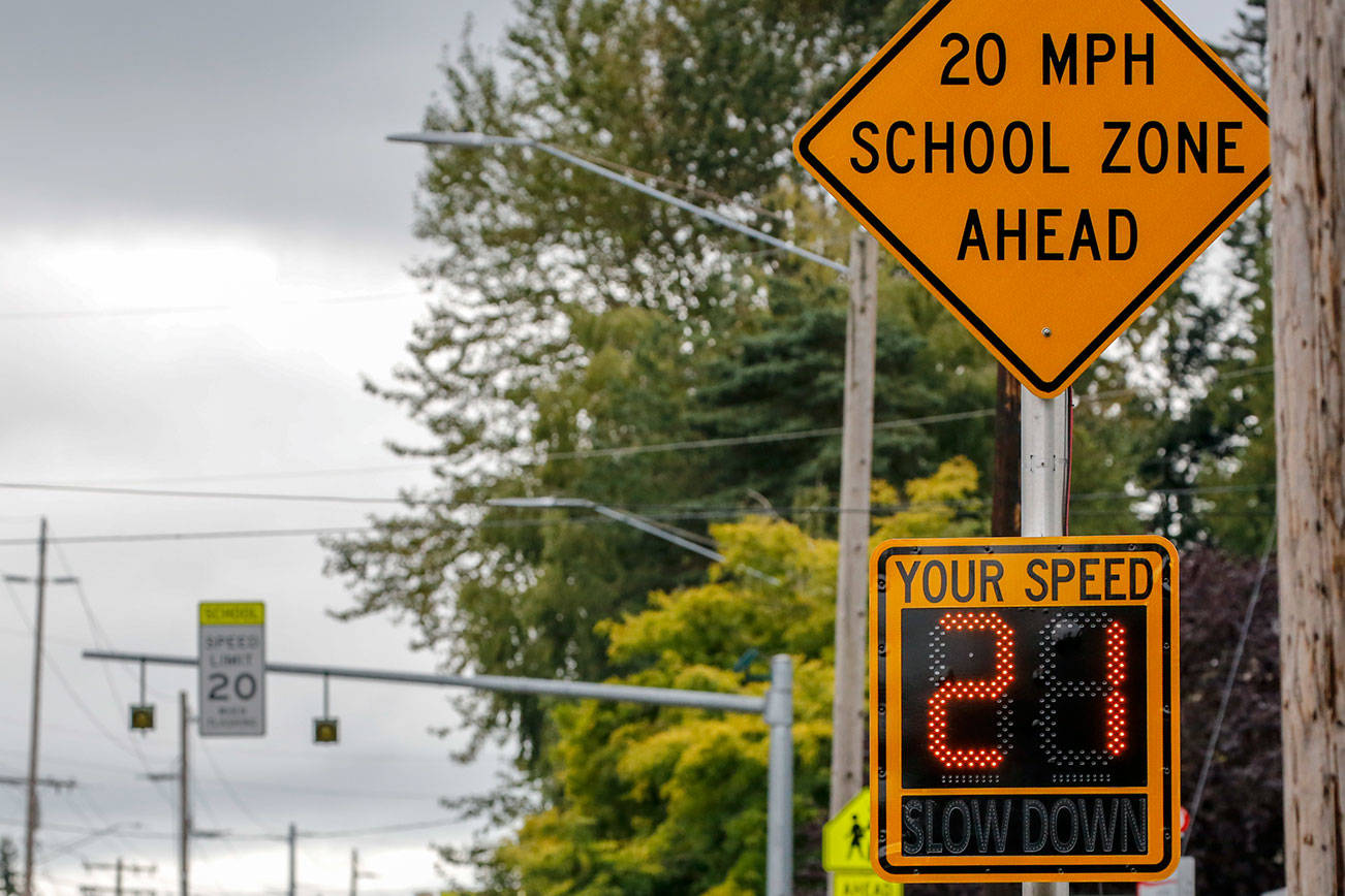 Some school zones with reduced speed limits are active, even though students aren't in the buildings, while others are not.  (Kevin Clark / The Herald)