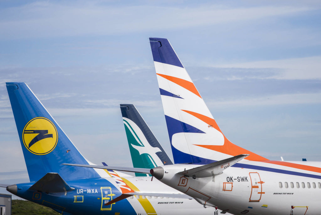 A group of airplanes sit parked on along Paine Field’s runway on Wednesday, Oct. 2, 2019 in Everett, Wa. (Olivia Vanni / The Herald)
