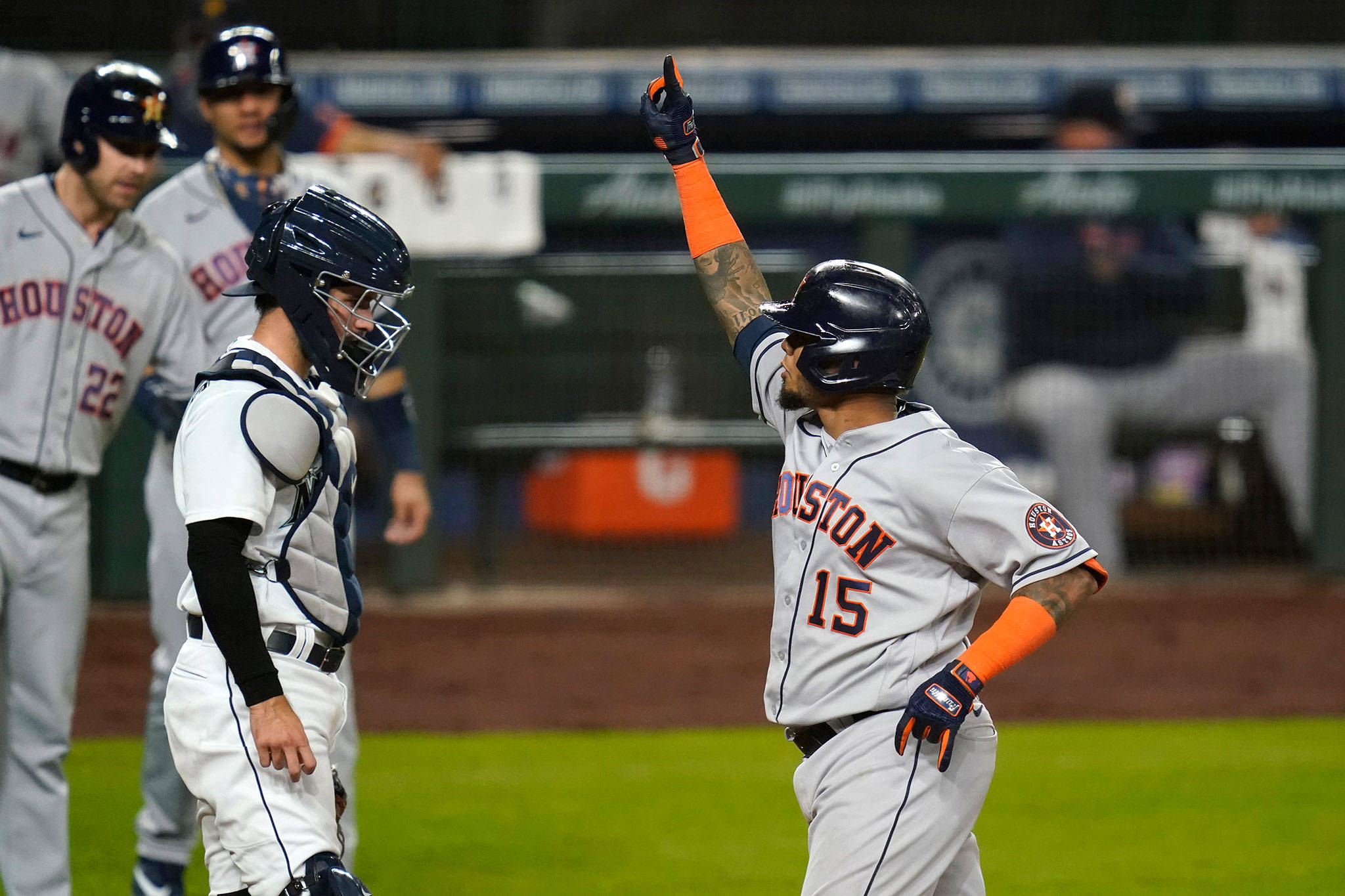 The Astros’ Martin Maldonado (15) celebrates as he crosses home plate in front of Mariners catcher catcher Luis Torrens after his three-run home run during the sixth inning of a game Sept. 22, 2020, in Seattle. (AP Photo/Elaine Thompson)
