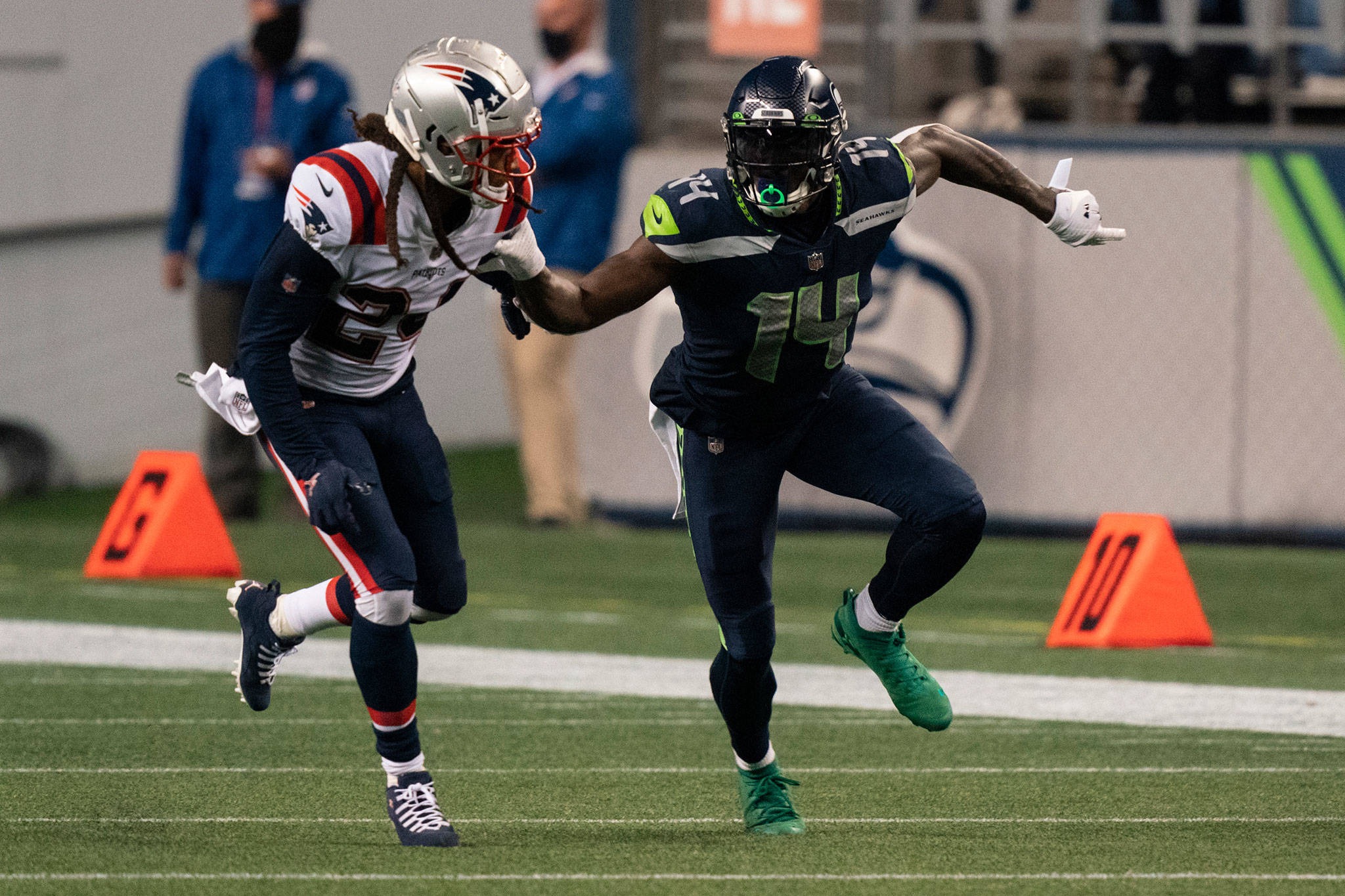 Seahawks wide receiver DK Metcalf (right) and Patriots defensive back Stephon Gilmore battle for position during the second half of a game Sept. 20, 2020, in Seattle. (AP Photo/Stephen Brashear)