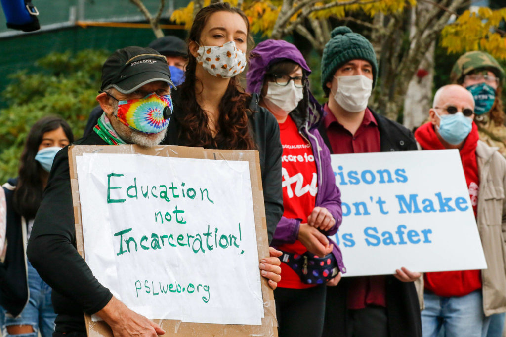Protesters gather Saturday to push reforms outside Denney Juvenile Justice Center in Everett. (Kevin Clark / The Herald)
