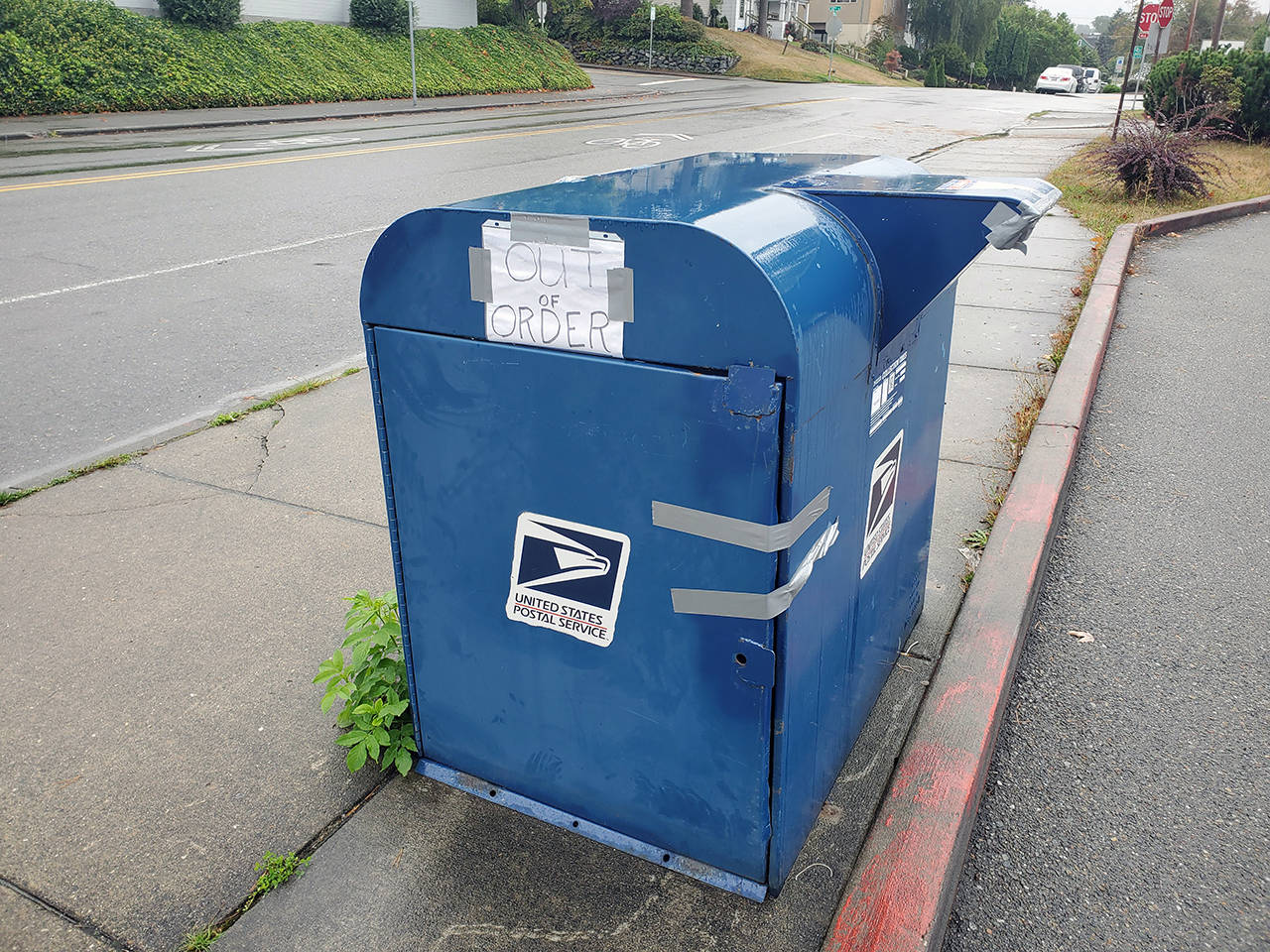 Vandals attempted to pry open a mail collection box on Hoyt Avenue in north Everett resulting in it being labelled “Out of Order.” (Ian Davis-Leonard / The Herald)