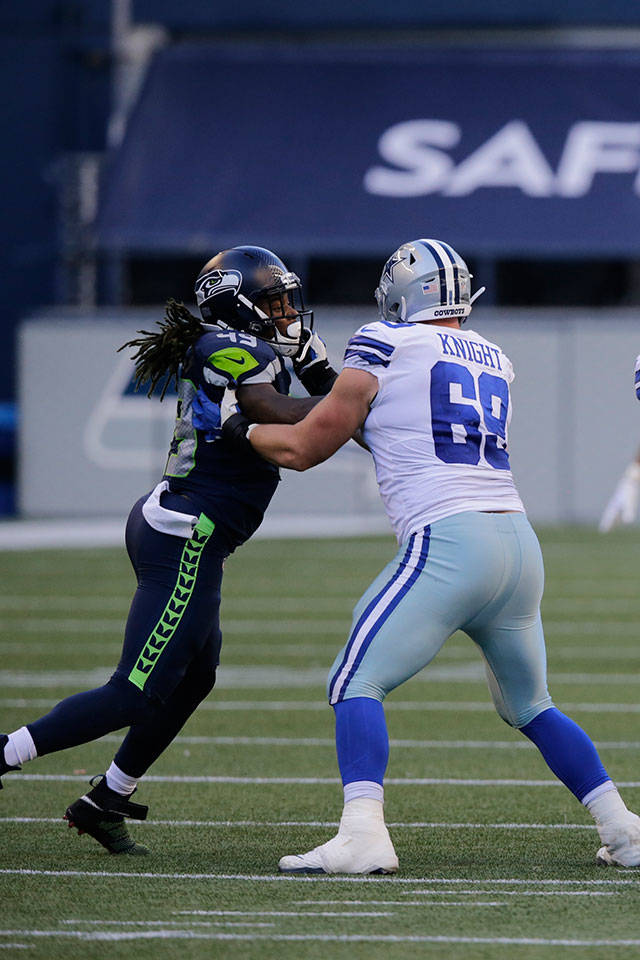 Seahawks outside linebacker Shaquem Griffin (left) battles Cowboys offensive tackle Brandon Knight during the second half of a game Sept. 27, 2020, in Seattle. (AP Photo/John Froschauer)
