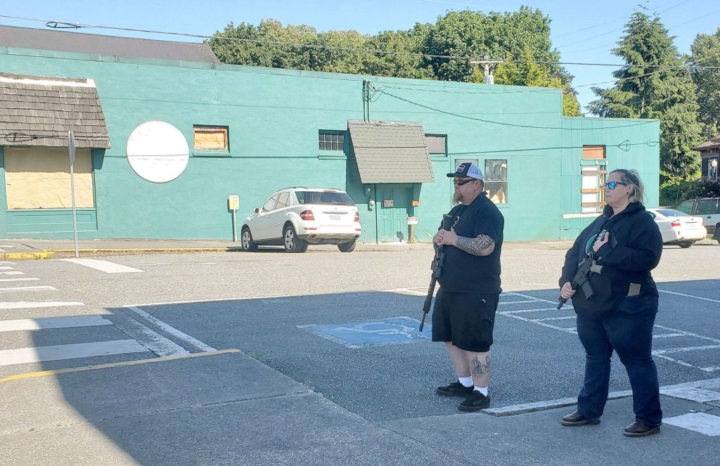 Armed citizens stand vigil in Snohomish on June 1. (Ian Davis-Leonard / The Herald)
