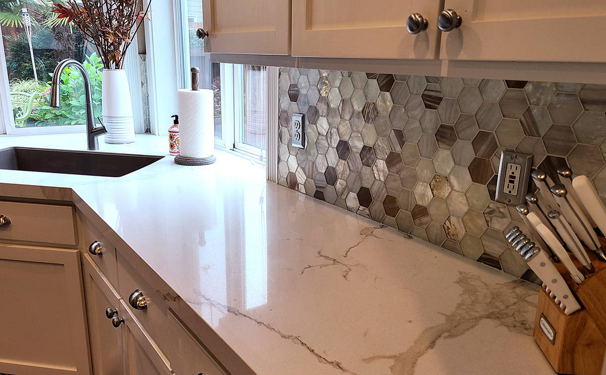 The backsplash Joanne picked out is always a favorite with visitors, and works great with the marbled countertop. Alvin says the crew from Granite Transformations was excellent to work with.