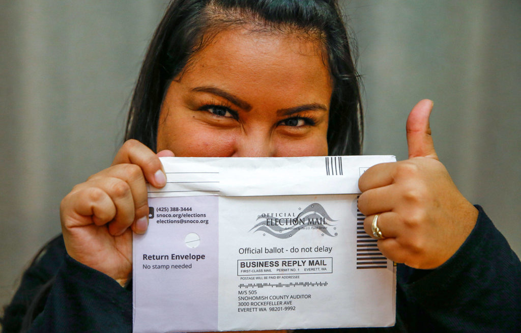 Jessica Figueroa, 27, a new United States citizen voting in her first election, says she is casting a vote that is the voice of her household. (Kevin Clark / The Herald)
