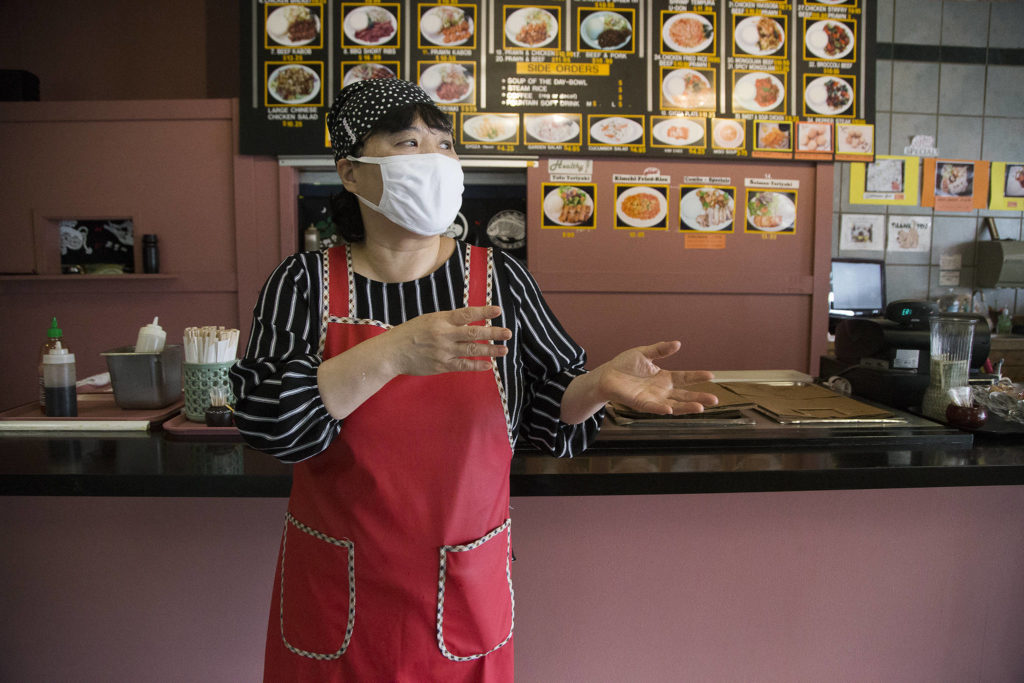 Sun Ho, owner of the Happy Tummy Grill, talks about the loss of business after Boeing announced the future closing of the 787 line. “If Boeing shuts down, I’m shut down too,” Ho said. (Andy Bronson / The Herald)
