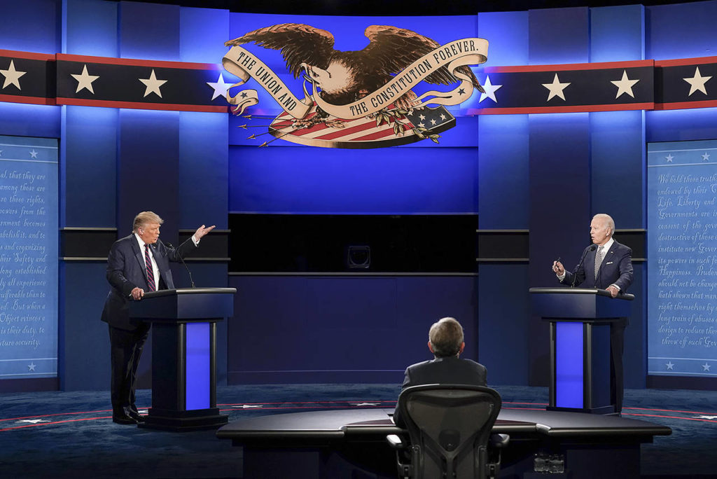 President Donald Trump (left) and Democratic presidential candidate former Vice President Joe Biden (right) stood about 10 feet apart during the first presidential debate Tuesday at Case Western University and Cleveland Clinic, in Cleveland, Ohio. Seated in the center is moderator Chris Wallace of Fox News. (AP Photo/Patrick Semansky)
