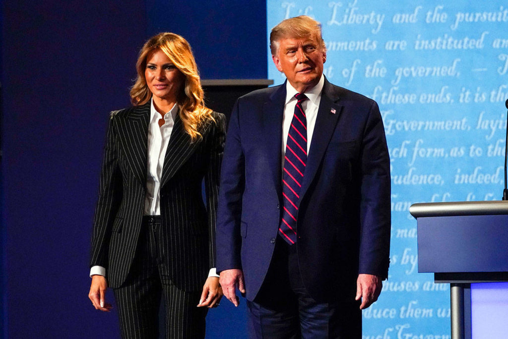 President Donald Trump stands on stage with first lady Melania Trump after the first presidential debate with Democratic presidential candidate former Vice President Joe Biden on Tuesday at Case Western University and Cleveland Clinic, in Cleveland, Ohio. (AP Photo/Julio Cortez)
