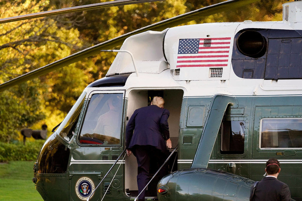 President Donald Trump boards Marine One as he leaves the White House to go to Walter Reed National Military Medical Center after he tested positive for COVID-19, Friday in Washington. (AP Photo/Alex Brandon)
