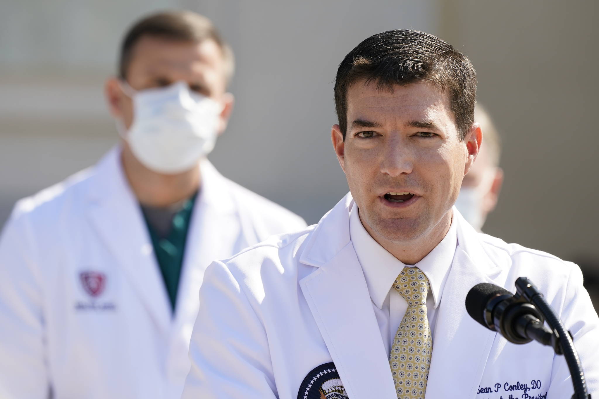 Dr. Sean Conley, physician to President Donald Trump, briefs reporters at Walter Reed National Military Medical Center in Bethesda, Md., Sunday, Oct. 4, 2020. Trump was admitted to the hospital after contracting the coronavirus. (AP Photo/Jacquelyn Martin)
