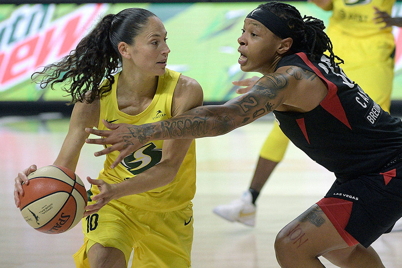 Seattle Storm guard Sue Bird (10) is defended by Las Vegas Aces forward Emma Cannon (32) during the second half of Game 2 of basketball's WNBA Finals, Sunday, Oct. 4, 2020, in Bradenton, Fla. (AP Photo/Phelan M. Ebenhack)