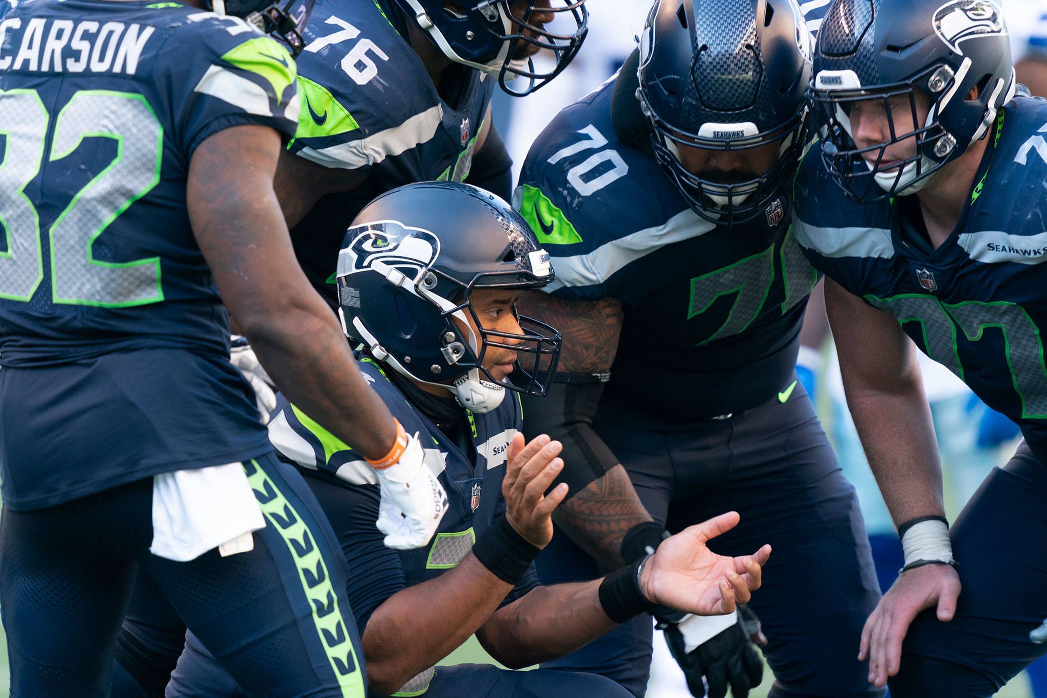 Seahawks quarterback Russell Wilson breaks the huddle during the second half of a game against the Cowboys on Sept. 27, 2020, in Seattle. (AP Photo/Stephen Brashear)