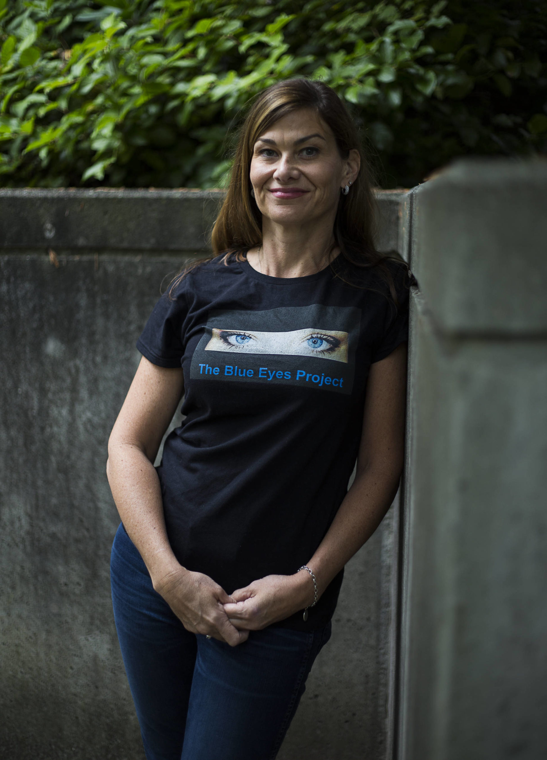 Kari Cedeno-Betancourt wearing a Blue Eyes Project shirt on Friday, a project started in remembrance of her daughter Payton Beck-Glessner in Everett. (Olivia Vanni / The Herald)