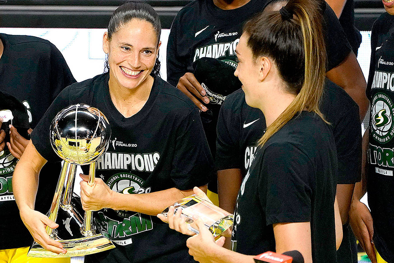 Seattle Storm guard Sue Bird, left, smiles at Breanna Stewart after the team defeated the Las Vegas Aces to win basketball’s WNBA championship last week in Bradenton, Fla. (AP Photo/Chris O’Meara)