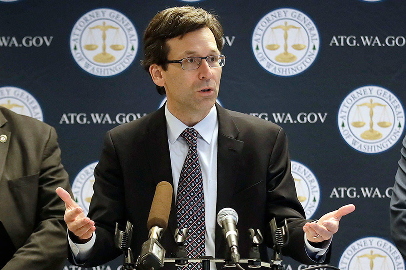 Washington state Attorney General Bob Ferguson, center, speaks as King County Prosecuting Attorney Dan Satterberg, left, and Thurston County Prosecuting Attorney Jon Tunheim look on during a news conference about Ferguson's lawsuit challenging a Trump Administration practice of ICE arrests at courthouses Tuesday, Dec. 17, 2019, in Seattle. Washington state has sued the Trump administration over its practice of arresting people at courthouses for immigration violations, saying it interferes with the state's authority to run its own judicial system. (AP Photo/Elaine Thompson)