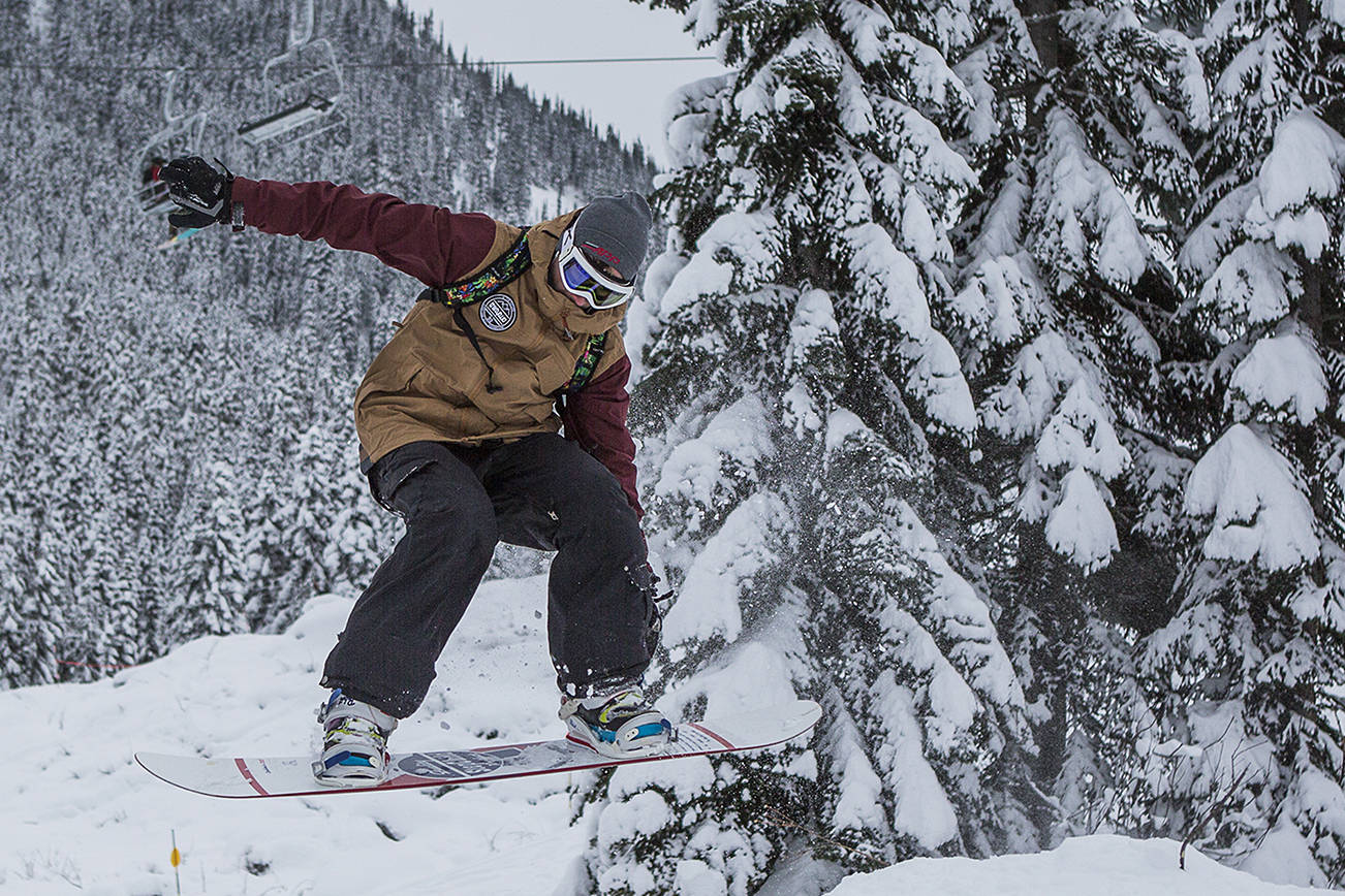 Ryan Leveck makes a jump as he makes his way down the slopes during the opening day of Stevens Pass on Wednesday, Dec. 18, 2019 in Stevens Pass, Wash. (Olivia Vanni / The Herald).