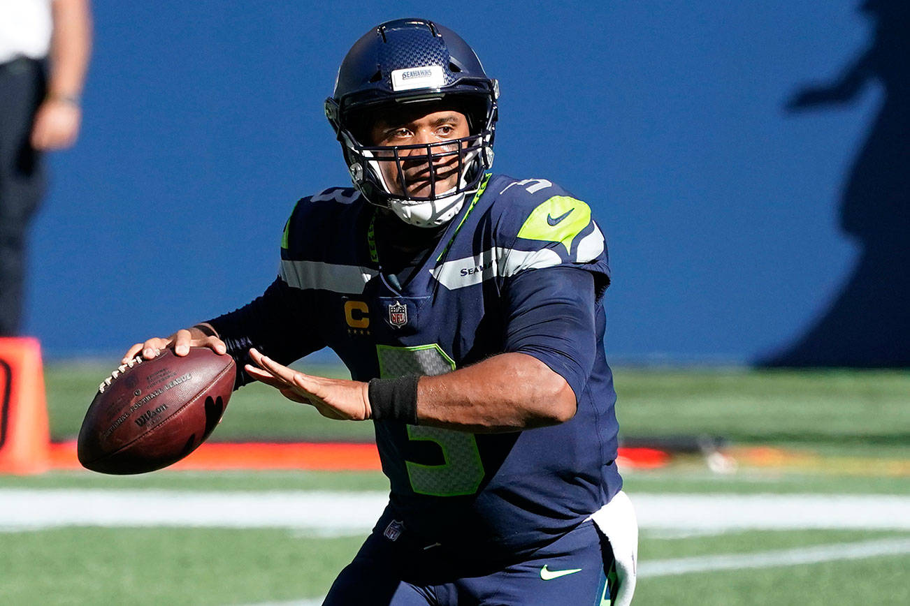 Seattle Seahawks quarterback Russell Wilson has been a huge factor in Seattle’s 5-0 start. (AP Photo/Elaine Thompson)