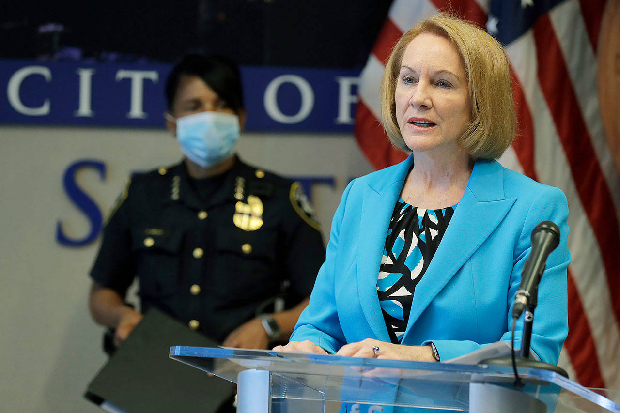 Seattle Mayor Jenny Durkan (right) speakson July 13 during a news conference at City Hall in Seattle. (AP Photo/Ted S. Warren)