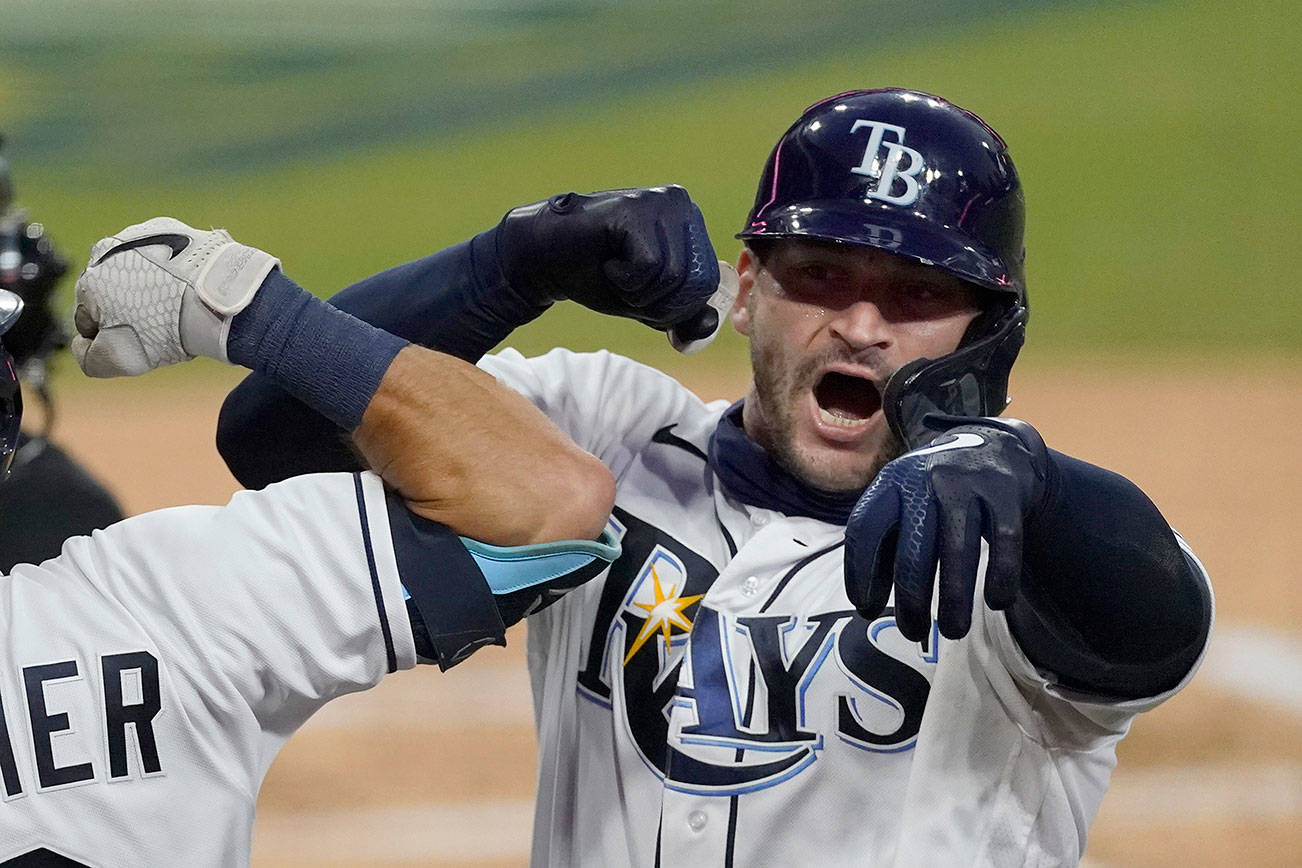 Tampa Bay Rays' Mike Zunino celebrates his solo home run against the Houston Astros during the second inning in Game 7 of a baseball American League Championship Series, Saturday, Oct. 17, 2020, in San Diego. (AP Photo/Ashley Landis)