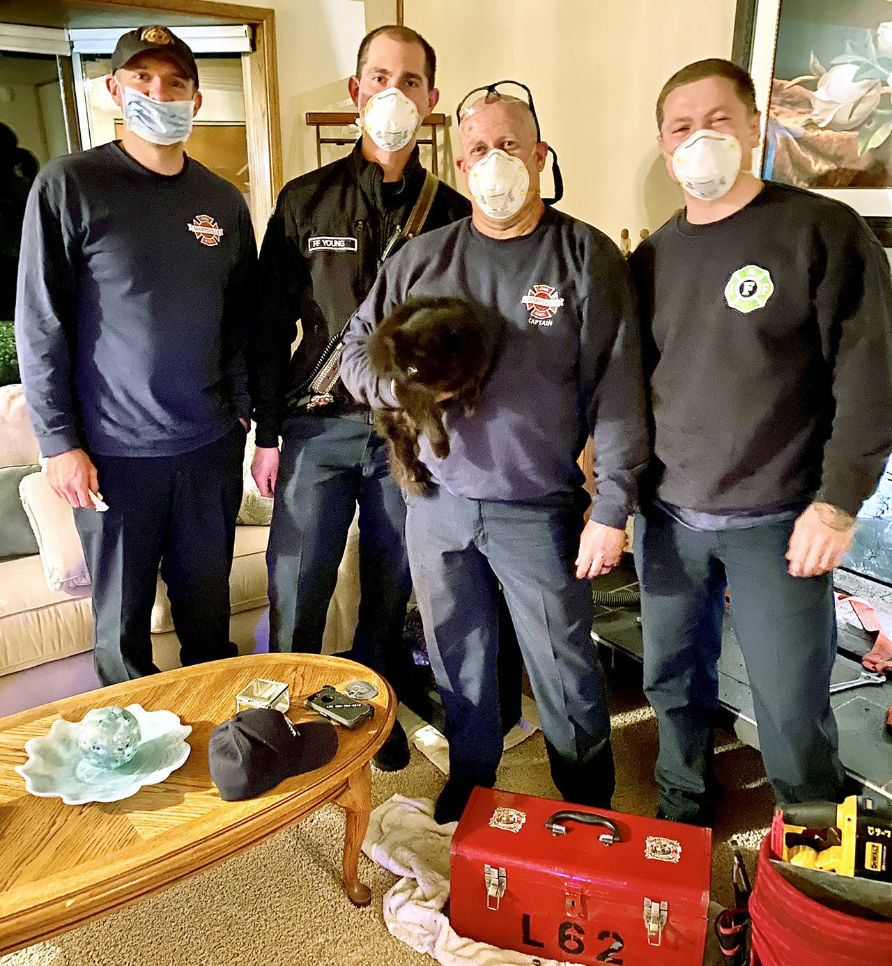 Firefighters rescued Bennett the cat from a chimney Sunday night. The cat was missing a week before someone heard him calling for help. Firefighters worked him out of the flue by hand. (Marysville Fire District)