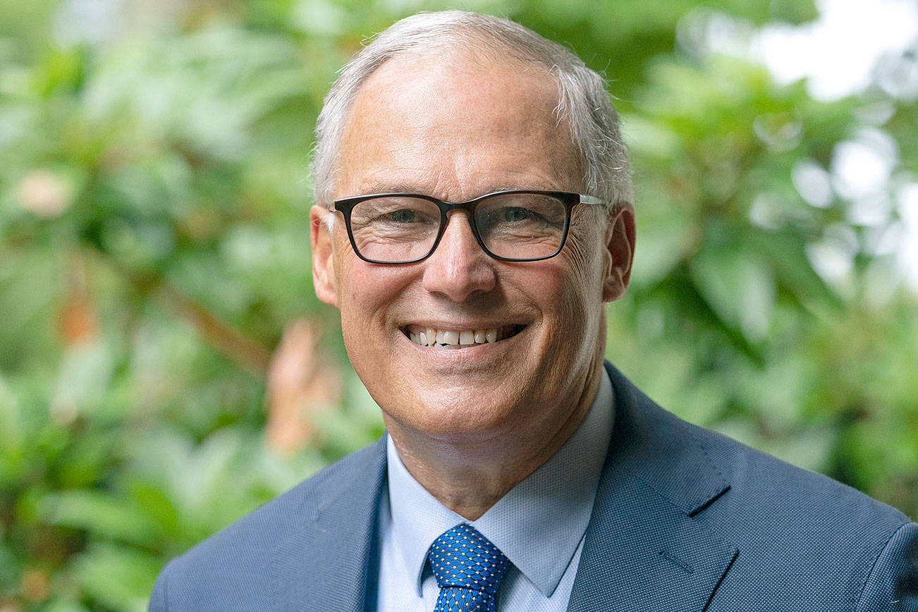 Washington Gov. Jay Inslee poses for a photo, Friday, Sept. 25, 2020, in Olympia, Wash. Inslee, a Democrat, is being challenged by Republican Loren Culp, police chief of the small town of Republic, Wash., in the Nov. 3 election. (AP Photo/Ted S. Warren)