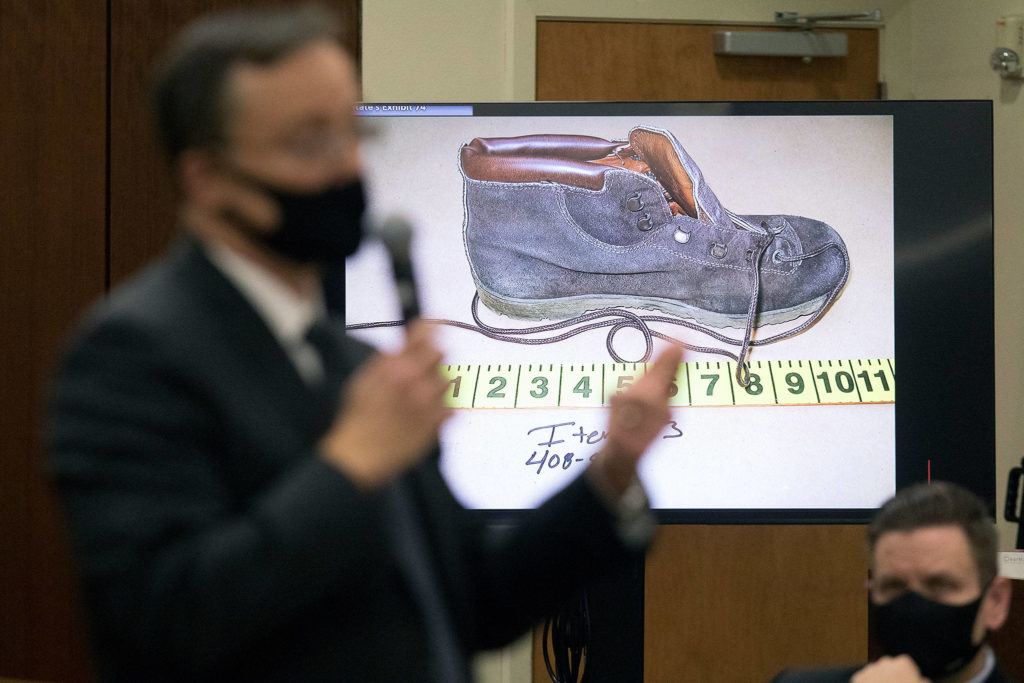 Snohomish County deputy prosecutor Craig Matheson talks about DNA found on a shoe, worn by Jody Loomis, during his opening statement in the murder trial of Terrence Miller at the Snohomish County Courthouse on Monday in Everett. (Andy Bronson / The Herald)
