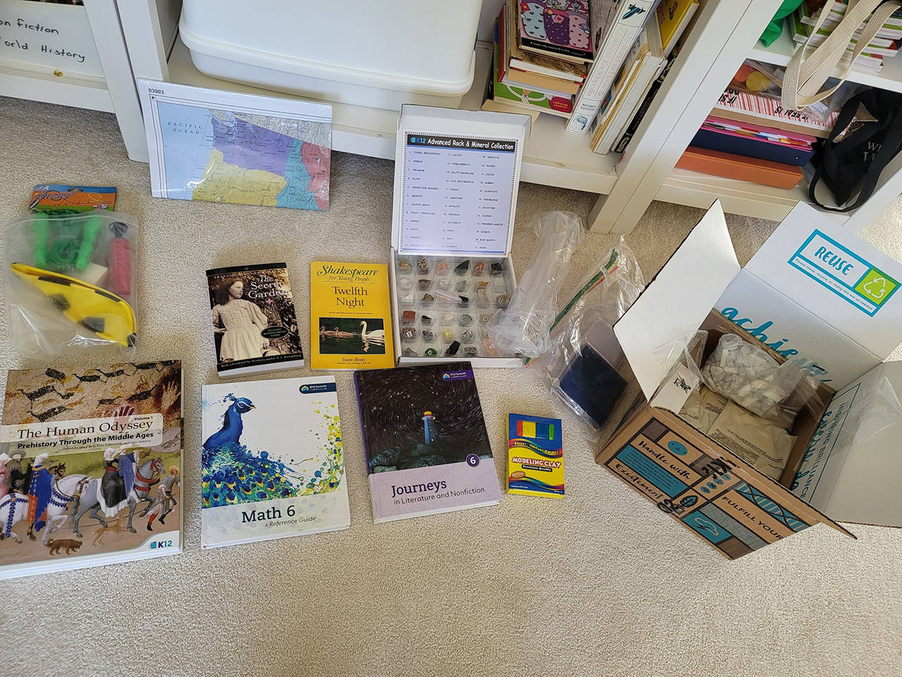 Washington Virtual Academy, a free public school option in Washington state, sends out kits of materials to help supplement online learning. Pictured here is the sixth-grade kit. (Jennifer Bardsley)