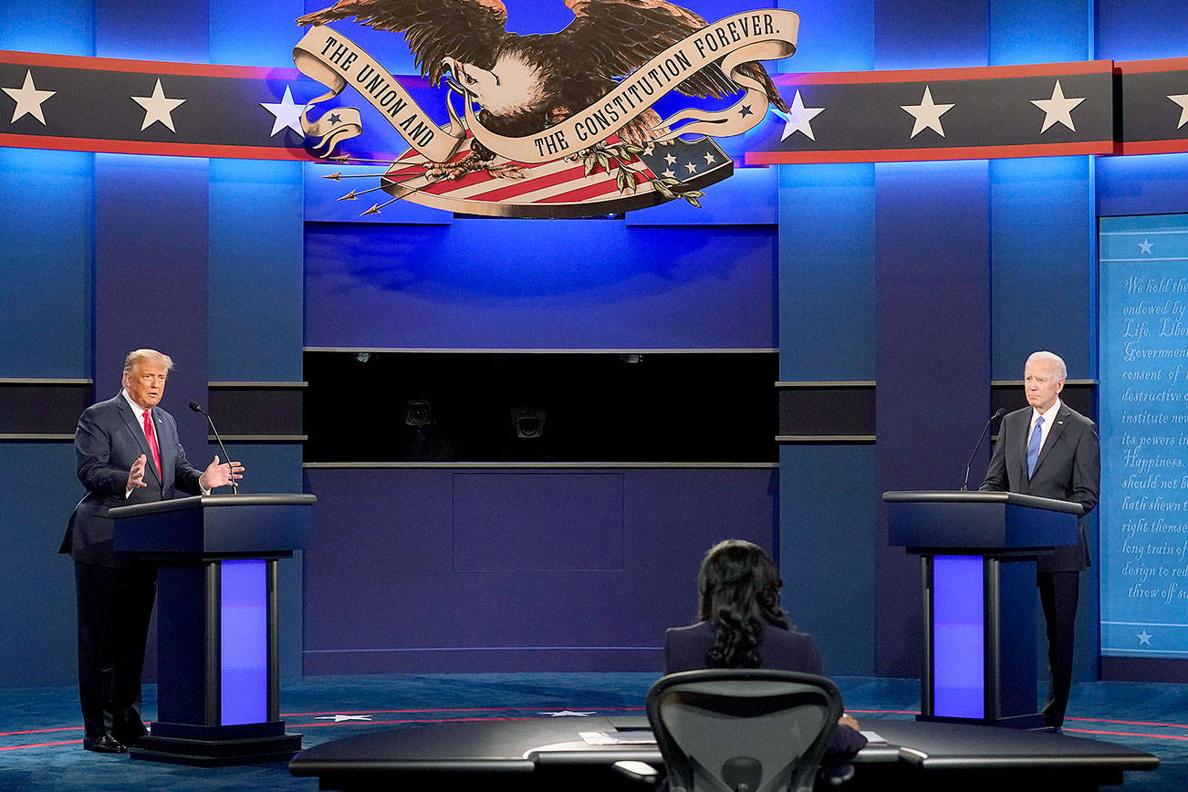 President Donald Trump, left, and Democratic presidential candidate former Vice President Joe Biden, left, during the second and final presidential debate Thursday, Oct. 22, 2020, at Belmont University in Nashville, Tenn. Seated in the center is moderator Kristen Welker of NBC News (AP Photo/Patrick Semansky)