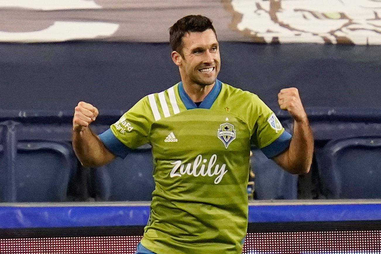 Seattle Sounders' Will Bruin reacts after scoring in stoppage time against the Portland Timbers in the second half of an MLS soccer match, Thursday, Oct. 22, 2020, in Seattle. (AP Photo/Elaine Thompson)