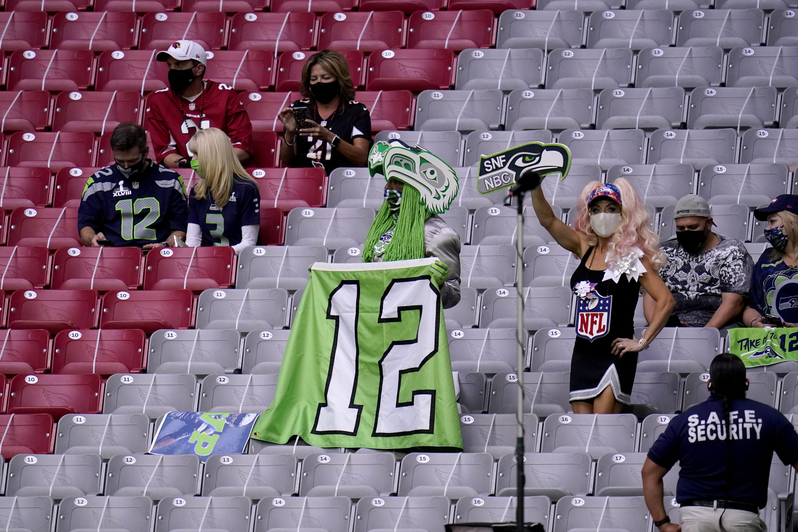 Seattle Seahawks fans watch prior to Seattle’s game against the Arizona Cardinals on Sunday at State Farm Stadium. (AP Photo/Ross D. Franklin)