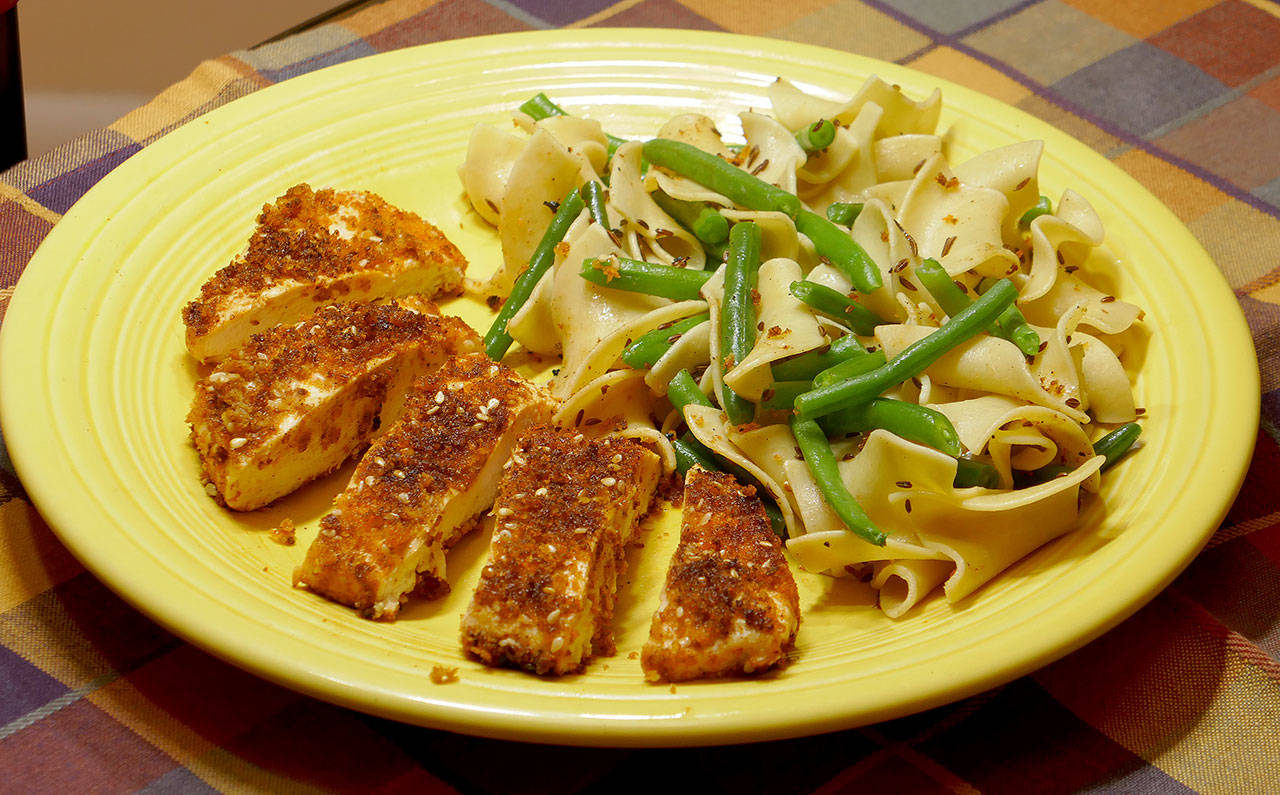 In this smoked paprika chicken with caraway noodles, the secret to keeping the chicken breast juicy is to pound it with a meat tenderizer. (Linda Gassenheimer)