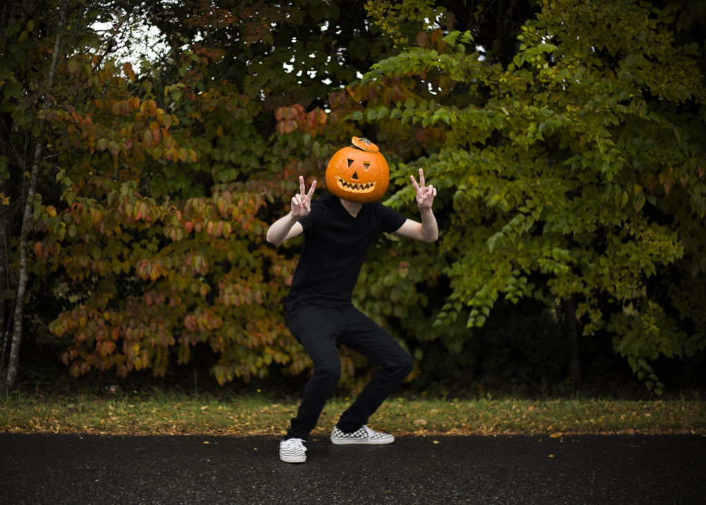 Brett Kelly poses as “Pumpkin Man,” his TikTok character, in Lake Stevens. (Olivia Vanni / The Herald) 

