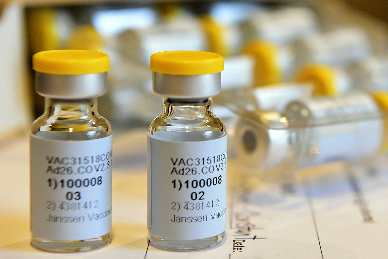 This September 2020 photo shows vials for a single-dose COVID-19 vaccine being developed by Johnson & Johnson. On Oct. 23, the company announced that the Food and Drug Administration is letting it resume testing of its COVID-19 vaccine candidate in the U.S. (Cheryl Gerber/Johnson & Johnson via AP)