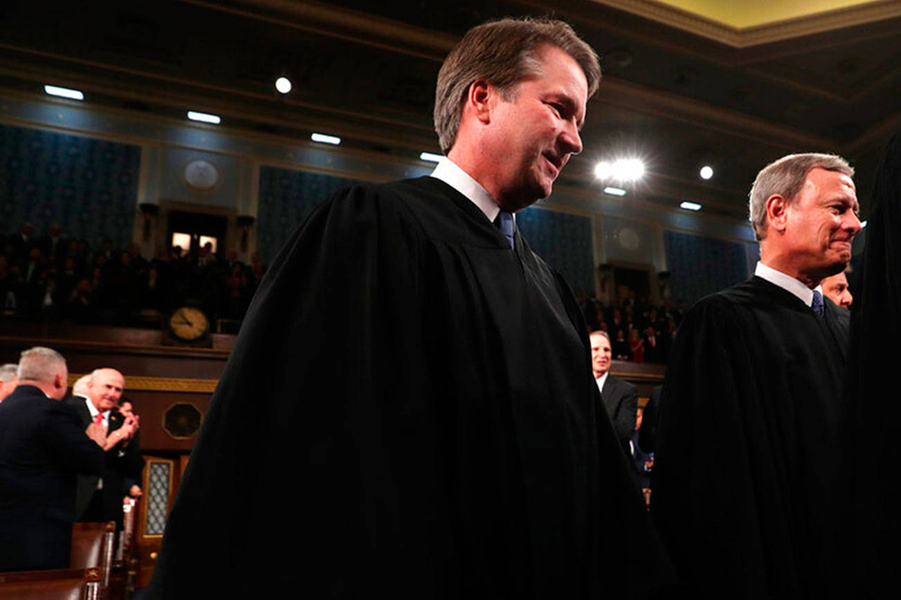 Supreme Court Chief Justice John Roberts, right, and Associate Justice Brett Kavanaugh, left, arrive before President Donald Trump delivers his State of the Union address to a joint session of Congress on Capitol Hill in Washington, Tuesday, Feb. 4, 2020. (Leah Millis/Pool via AP)