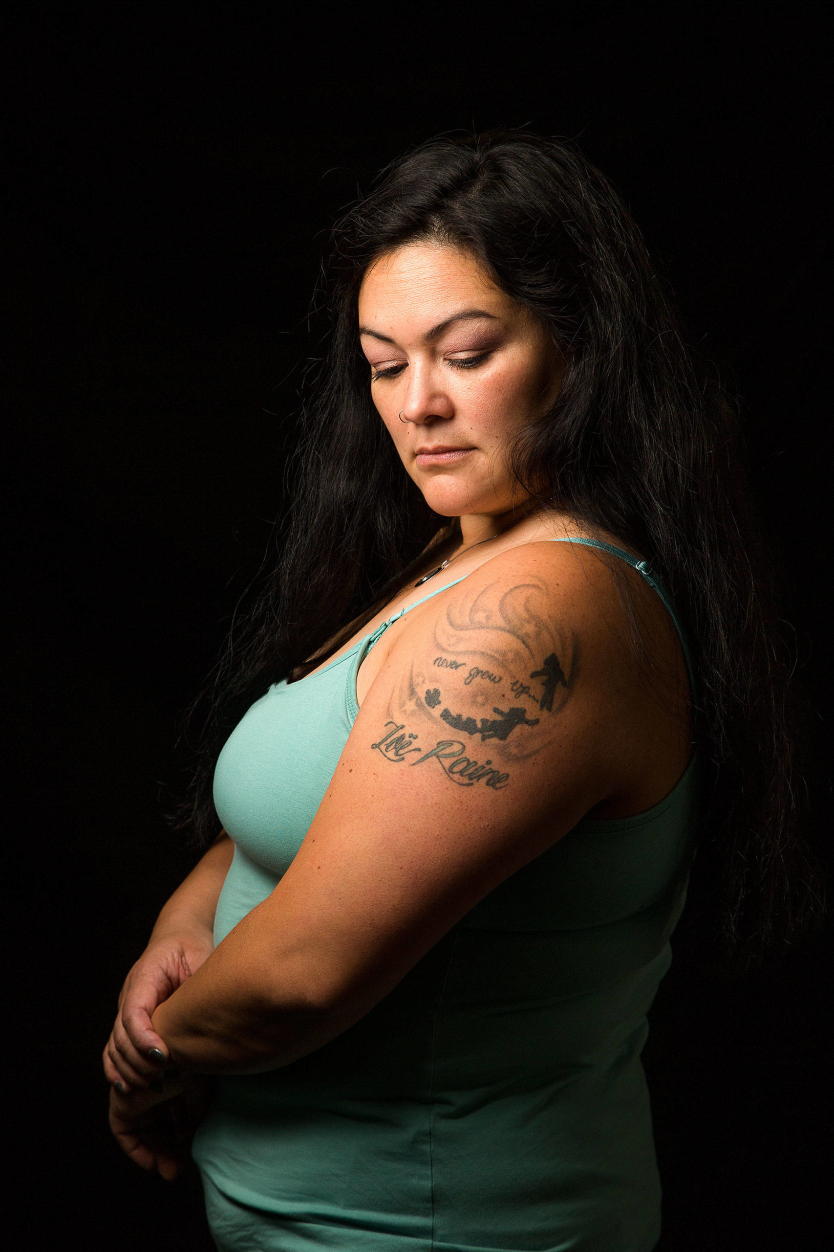 Michelle Jeffreys shows a tattoo honoring her daughter, Marysville Pilchuck High School shooting victim Zoe Galasso. (Andy Bronson / The Herald)