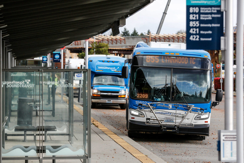 Community Transit is preparing to shift commuter buses that go to the University of Washington in Seattle to connect with Link light rail in Northgate next year. (Kevin Clark / The Herald)

