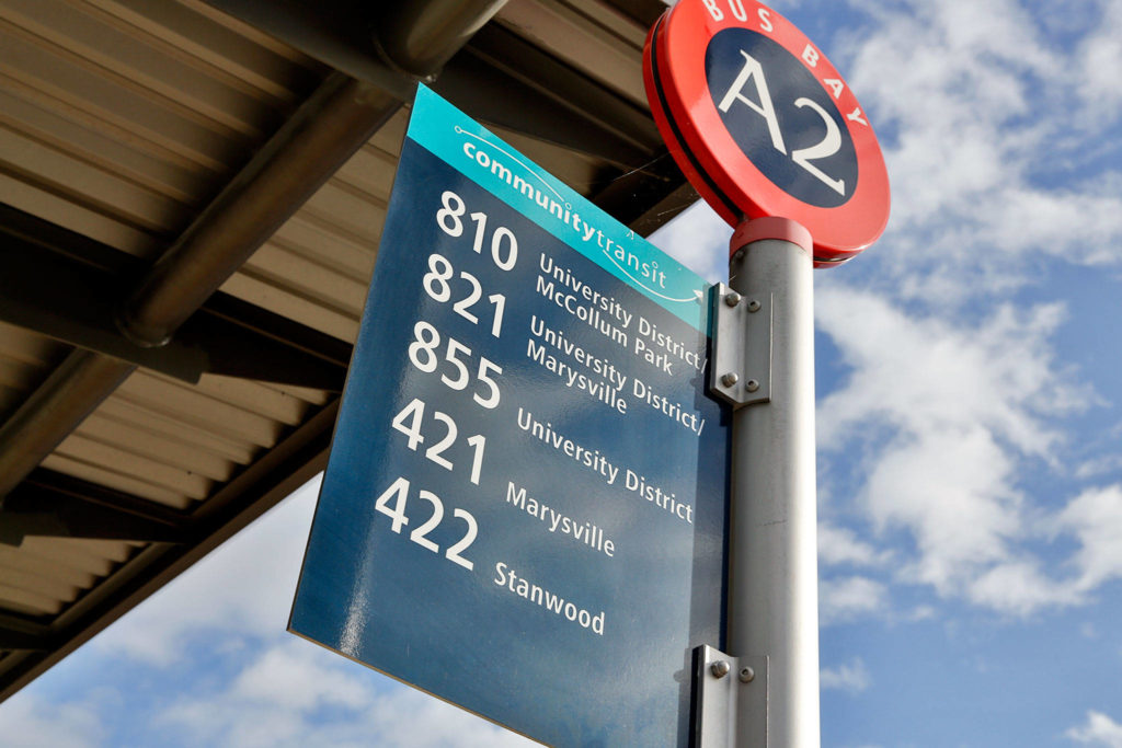Community Transit is preparing to shift commuter buses, including the 800-series, that go to the University of Washington in Seattle to connect with Link light rail in Northgate next year. (Kevin Clark / The Herald)
