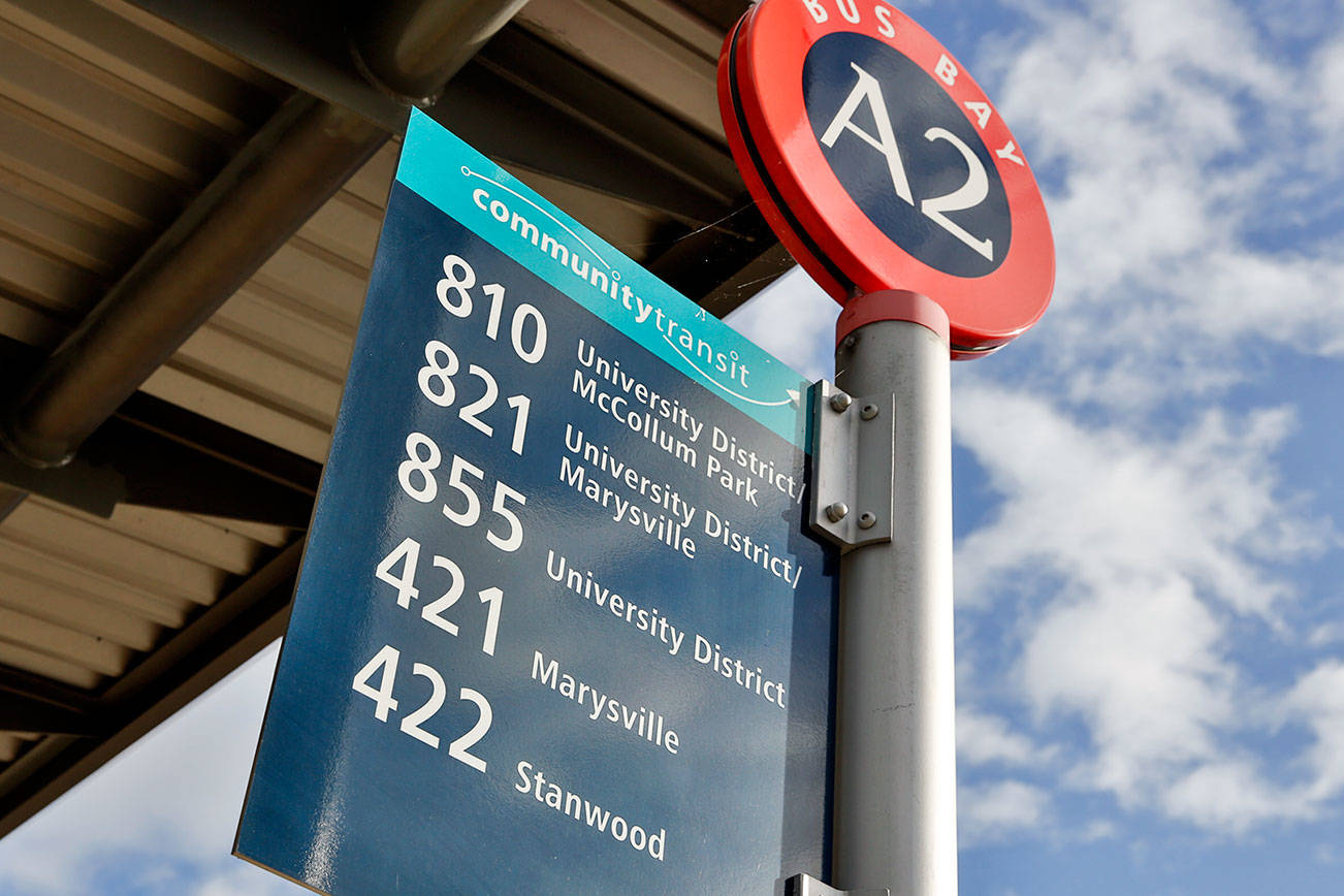 Community Transit is preparing to shift commuter buses that go to the University of Washington in Seattle to connect with Link light rail in Northgate next year. (Kevin Clark / The Herald)