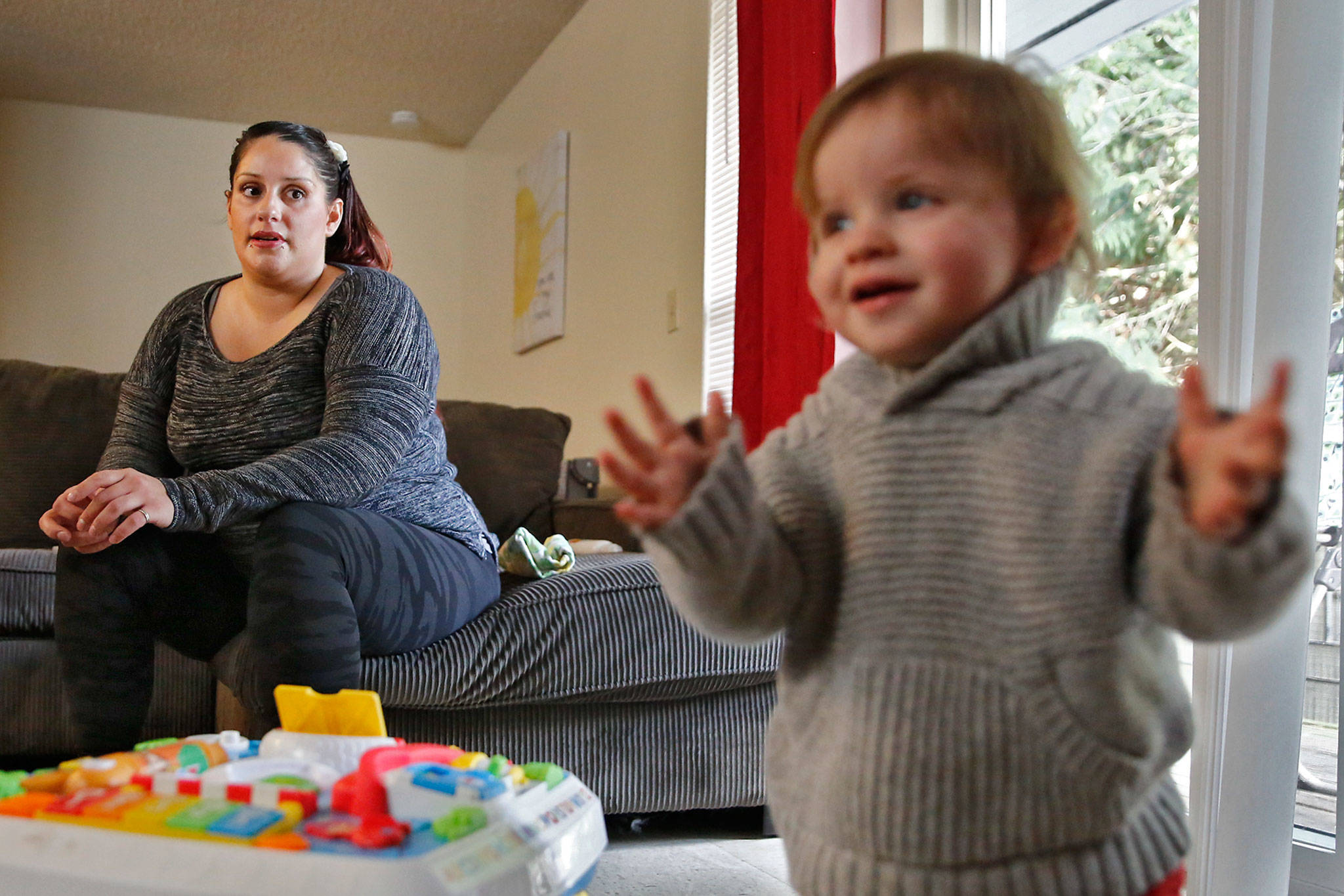 Ashlie Belt and her year-old son, Kaiden Hoffman, were among clients who were helped by Pacific Treatment Alternatives’ housing program for women overcoming addiction, ESTEEM, which is losing a basic needs grant from United Way. (Kevin Clark / The Herald)