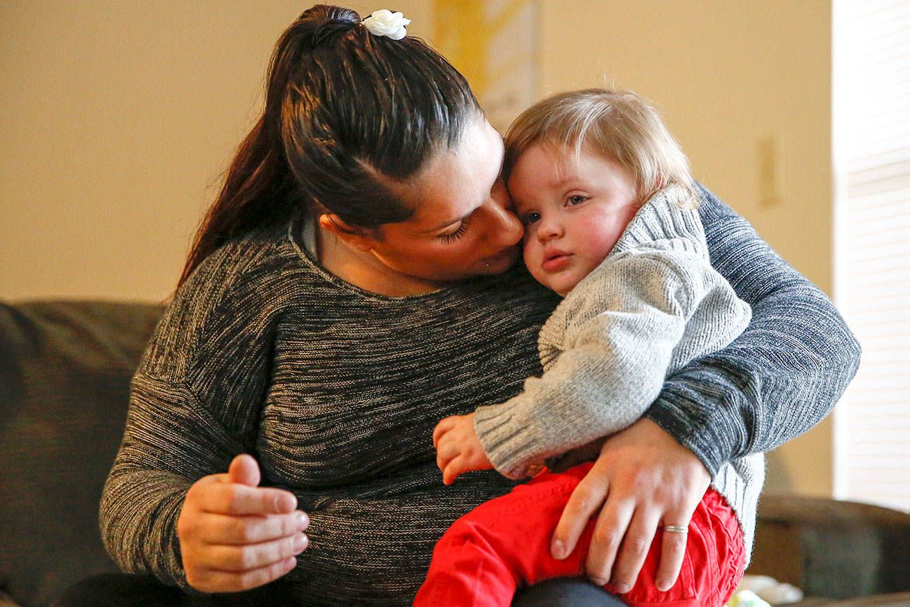 Ashlie Belt and her year-old son, Kaiden Hoffman, were among clients who were helped by Pacific Treatment Alternatives' housing program for women overcoming addiction, ESTEEM, which is losing a basic needs grant from United Way. (Kevin Clark / The Herald)